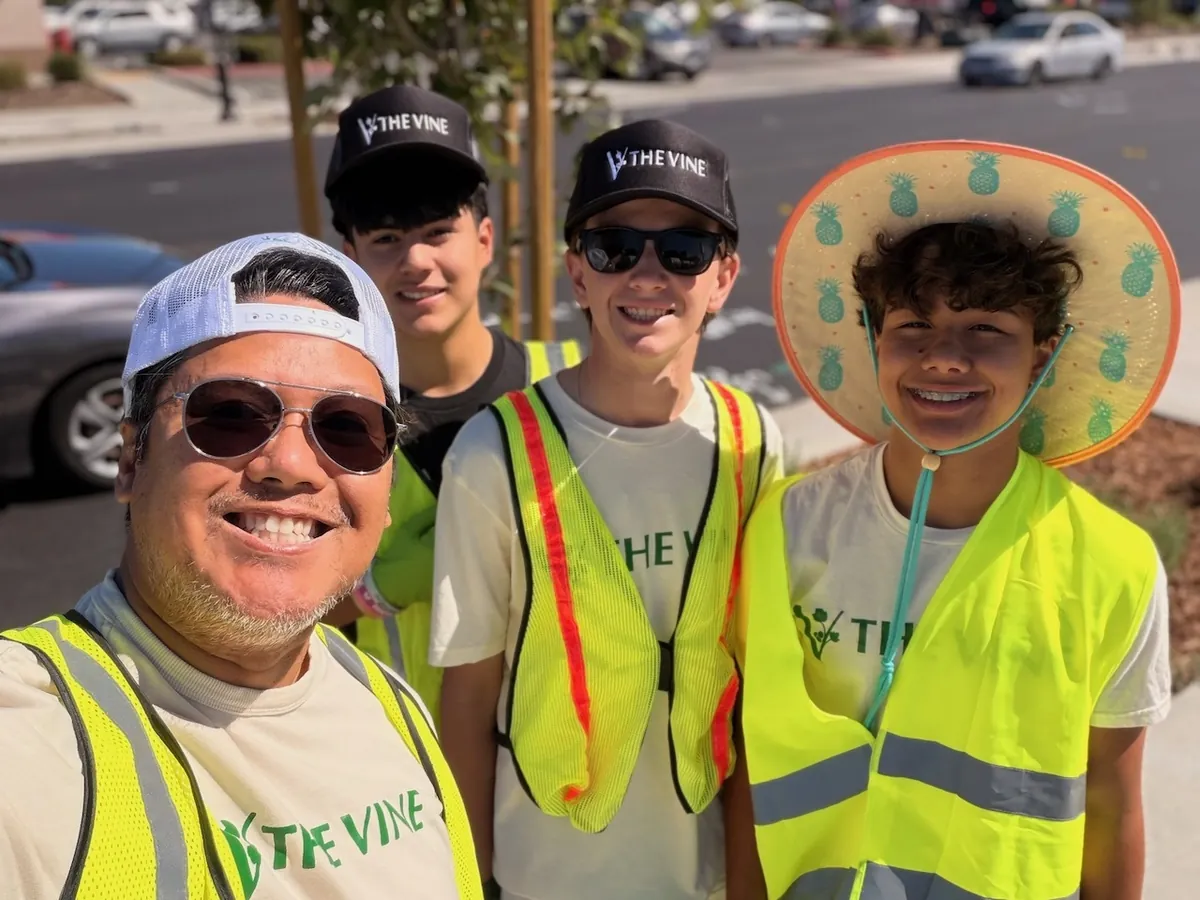 Volunteers in high-visibility safety vests during a street cleanup in Fairfield